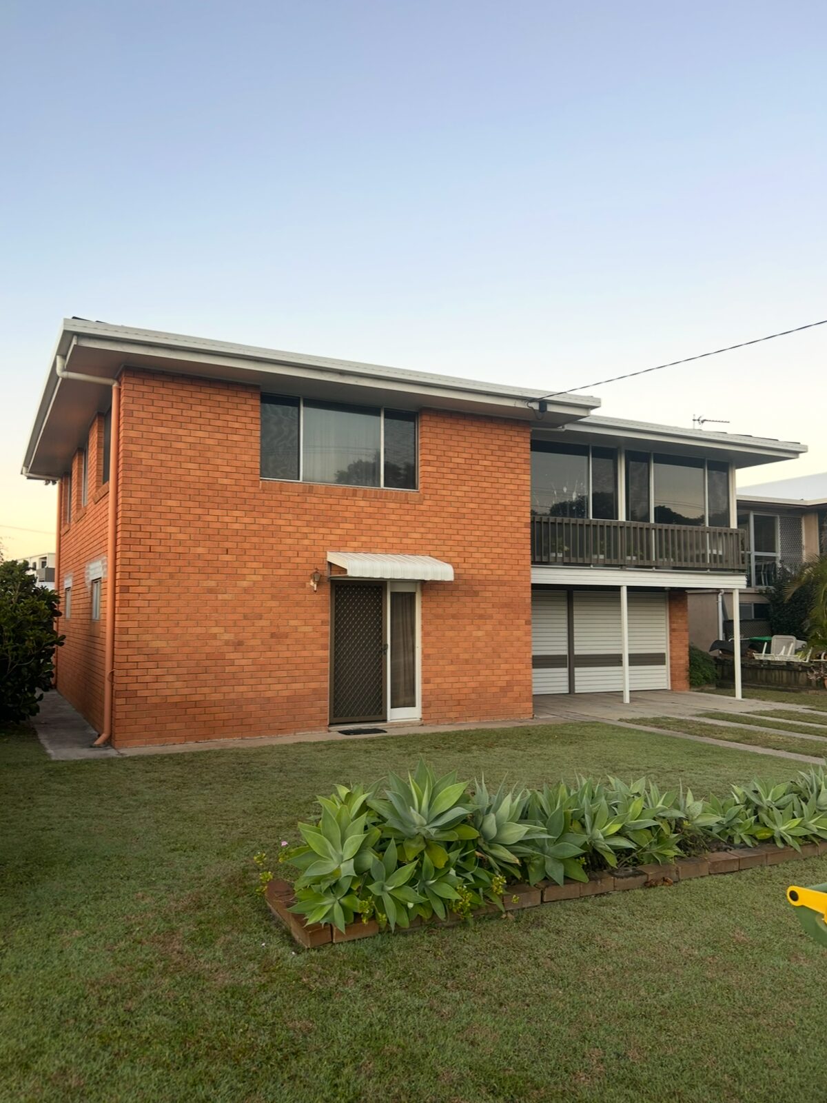 Red brick two-storey, fully rendered — before render